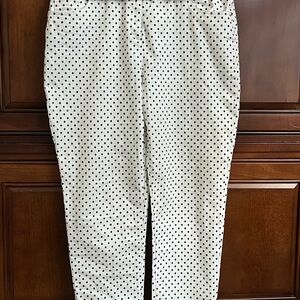 White/black polka dot jean pants. Chico size 2